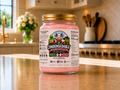 Jar of pink condensed milk on a kitchen counter with a 'Condensable' label.