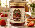 Jar of strawberry jelly fruit spread with a kitchen background